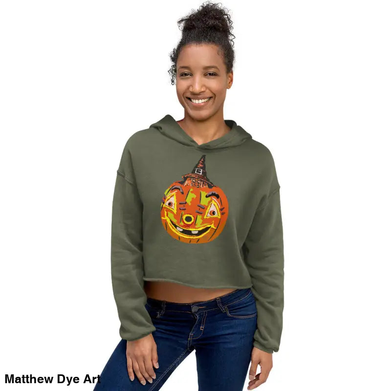 Woman in a cropped Halloween hoodie featuring an enchanted pumpkin witch design
