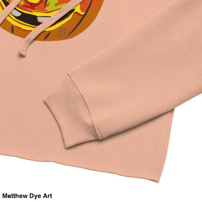 Peach-colored cropped hoodie featuring an Enchanted Pumpkin Witch design for Halloween