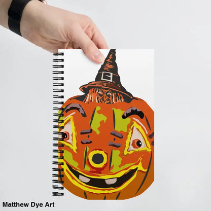 Spiral-bound notebook featuring Pumpkin Witch spiral design by Matthew Dye Art
