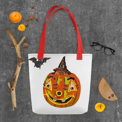 White tote bag featuring a smiling Halloween pumpkin design, embodying vintage Halloween charm