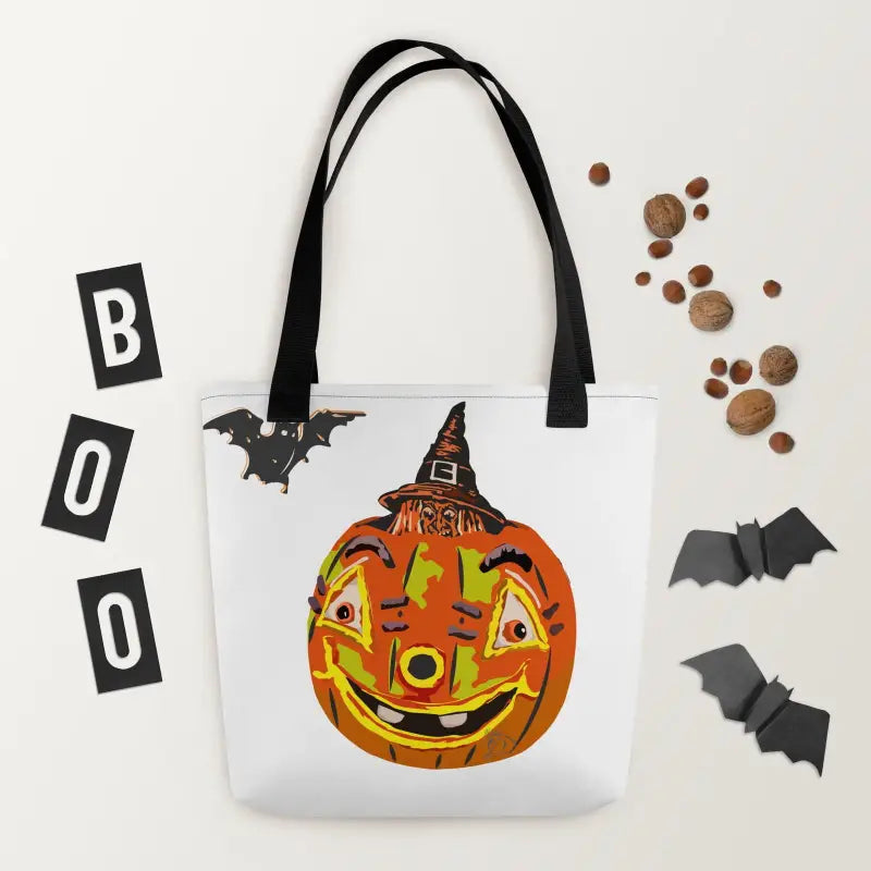 White tote bag with a smiling jack-o’-lantern and witch hat embodying vintage Halloween charm