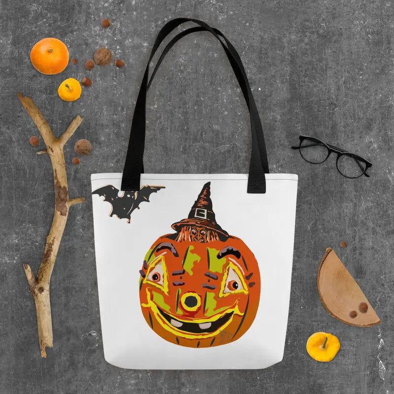 White tote bag with smiling pumpkin witch and bats, showcasing vintage Halloween charm