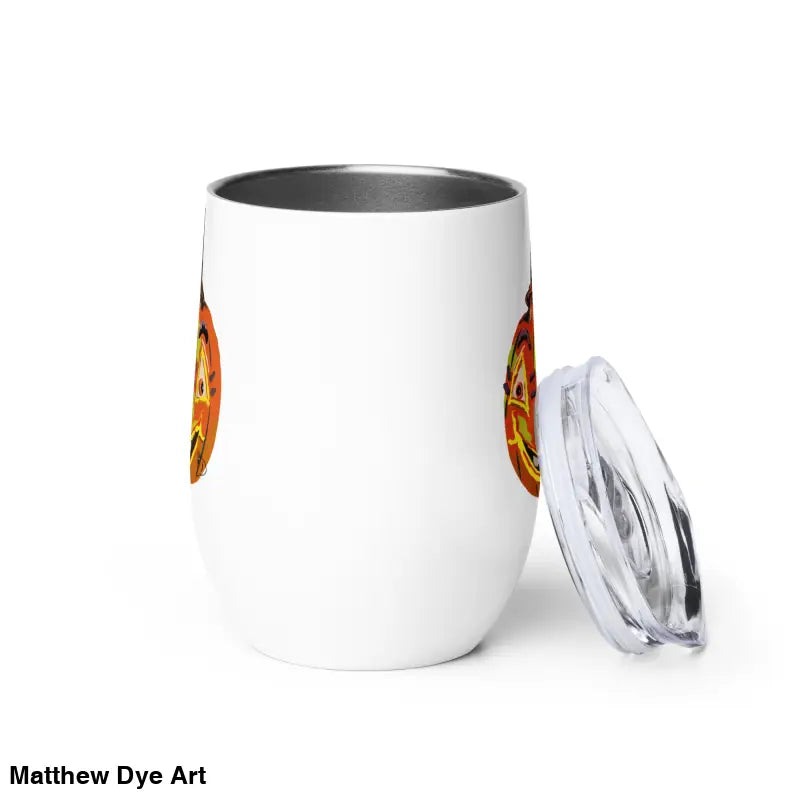White insulated wine tumbler with lid featuring Matthew Dye art of a whimsical pumpkin witch