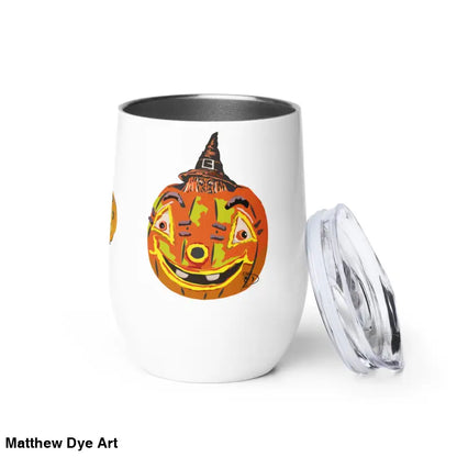 White tumbler featuring whimsical pumpkin witch design by Matthew Dye Art