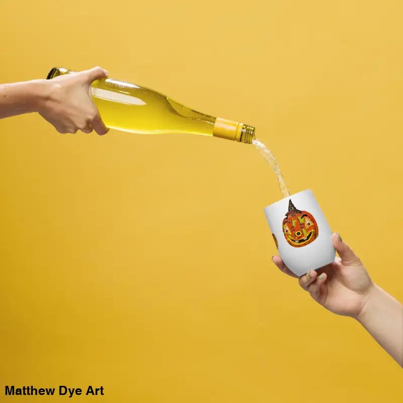 Halloween-themed wine glass displaying Matthew Dye art featuring a whimsical pumpkin witch
