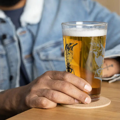 Glass of golden beer with foam in a Raven Design shaker pint glass