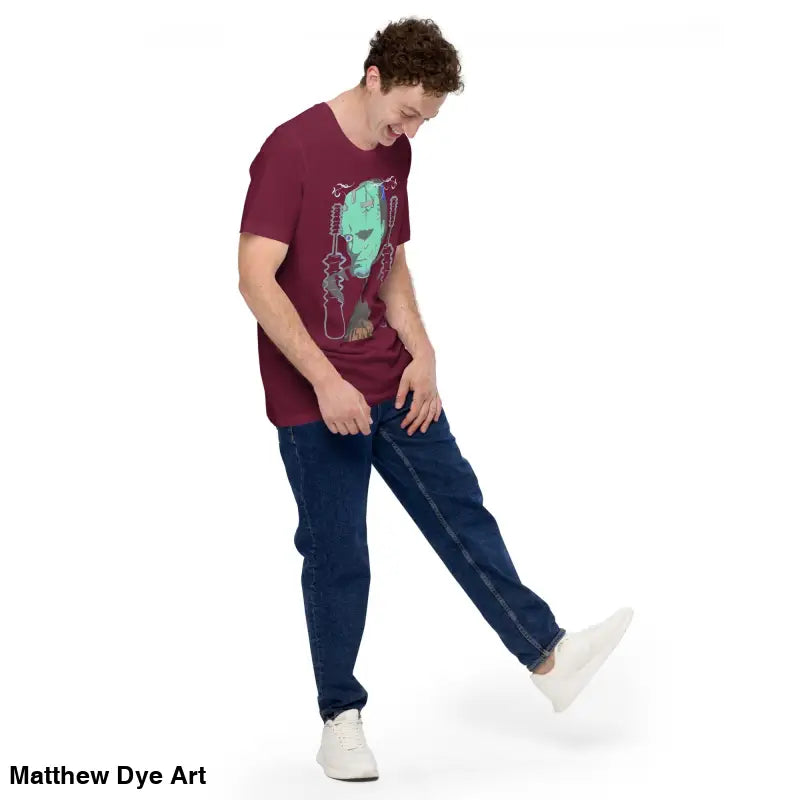 Man in maroon t-shirt and jeans wearing the Franky Unisex T-Shirt, inspired by Frankenstein’s Monster