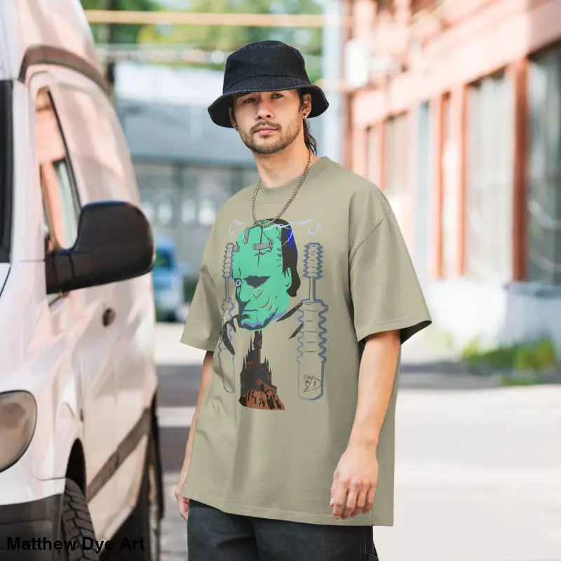 Man in Retro Franky Oversized T-Shirt featuring Matthew Dye art on a tempestuous autumn night