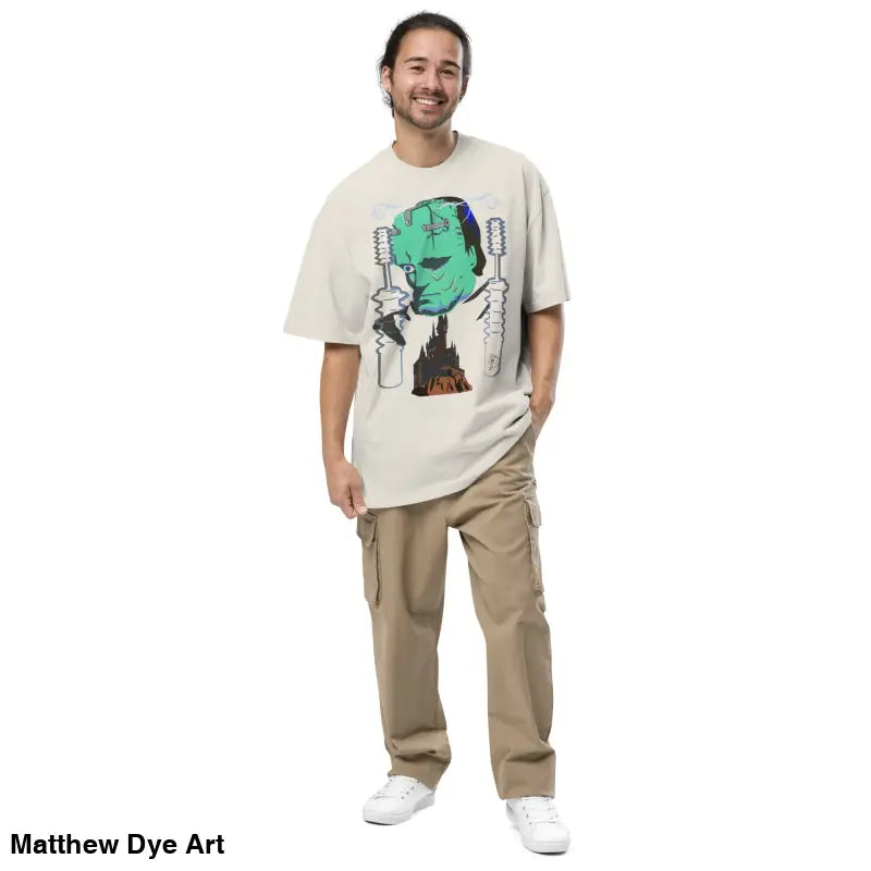 Man wearing Retro Franky Oversized T-Shirt by Matthew Dye Art on a tempestuous autumn night