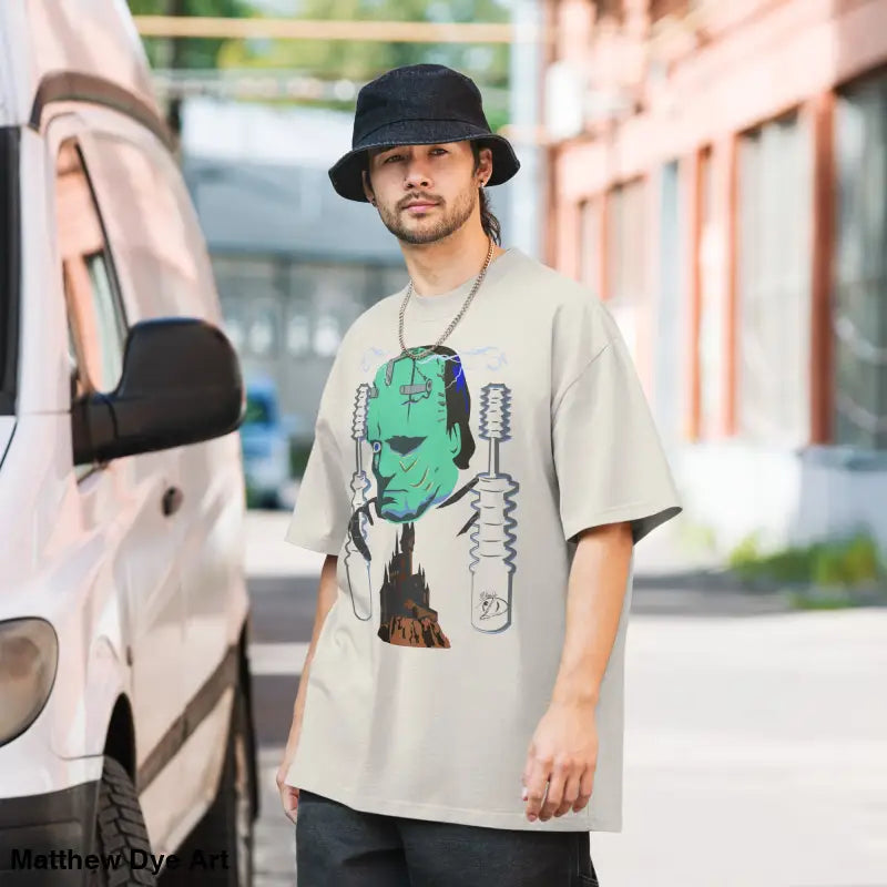 Man wearing Retro Franky Oversized T-Shirt with Matthew Dye art on a tempestuous autumn night