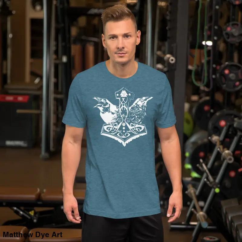 Man’s blue Odin’s Chosen tee featuring white graphic, transcending mere apparel