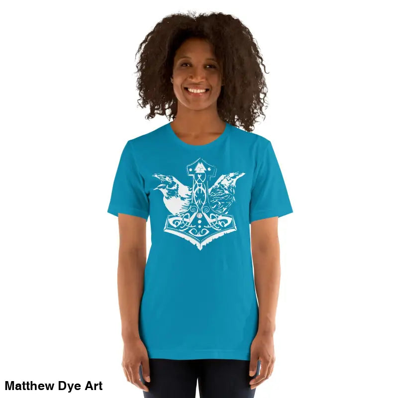 Woman in blue Odin’s Chosen Tee with white graphic, transcends mere apparel