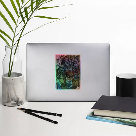 Silver laptop adorned with Romero holographic stickers, merging elegance and artistry