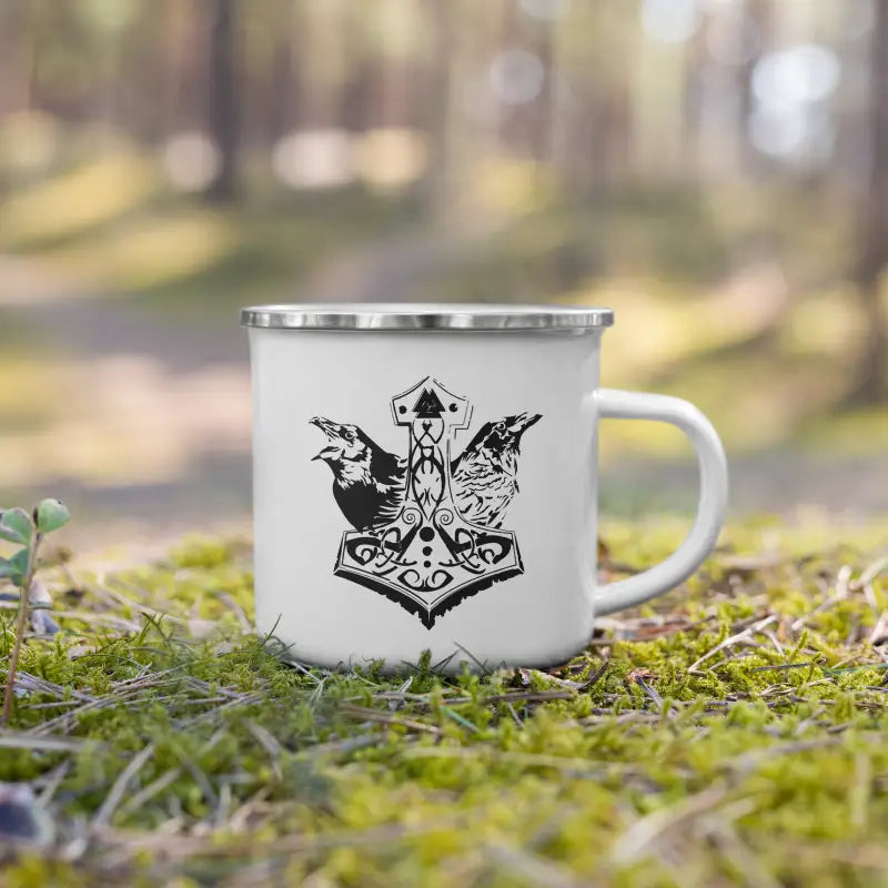 White enamel cup showcasing black Norse-style Thor’s hammer on rugged white enamel design