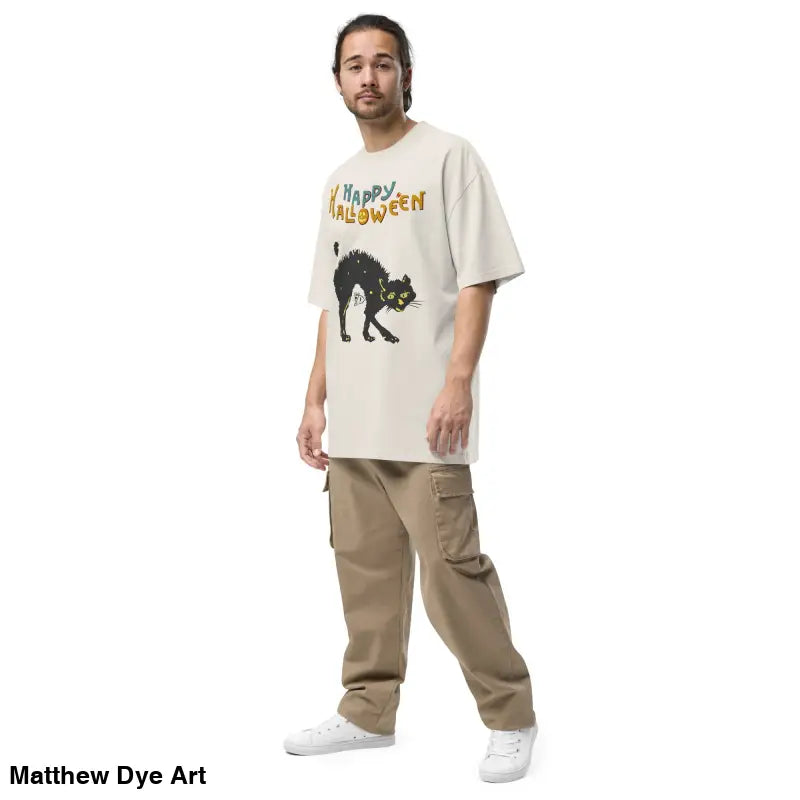 Beige oversized Halloween tee featuring a spooky black cat graphic for stylish celebrations