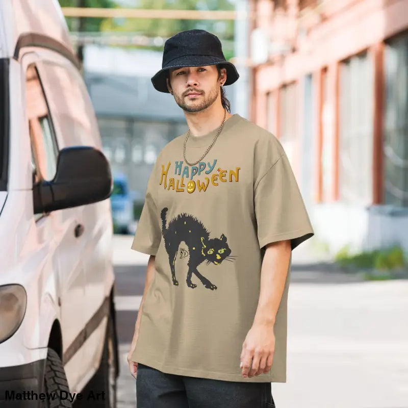 Tan Halloween oversized faded t-shirt featuring a spooky black cat design