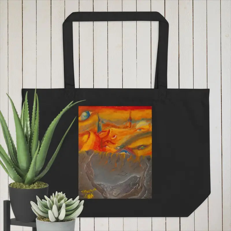 Black organic cotton tote showcasing abstract orange and gray artwork in artistic flair