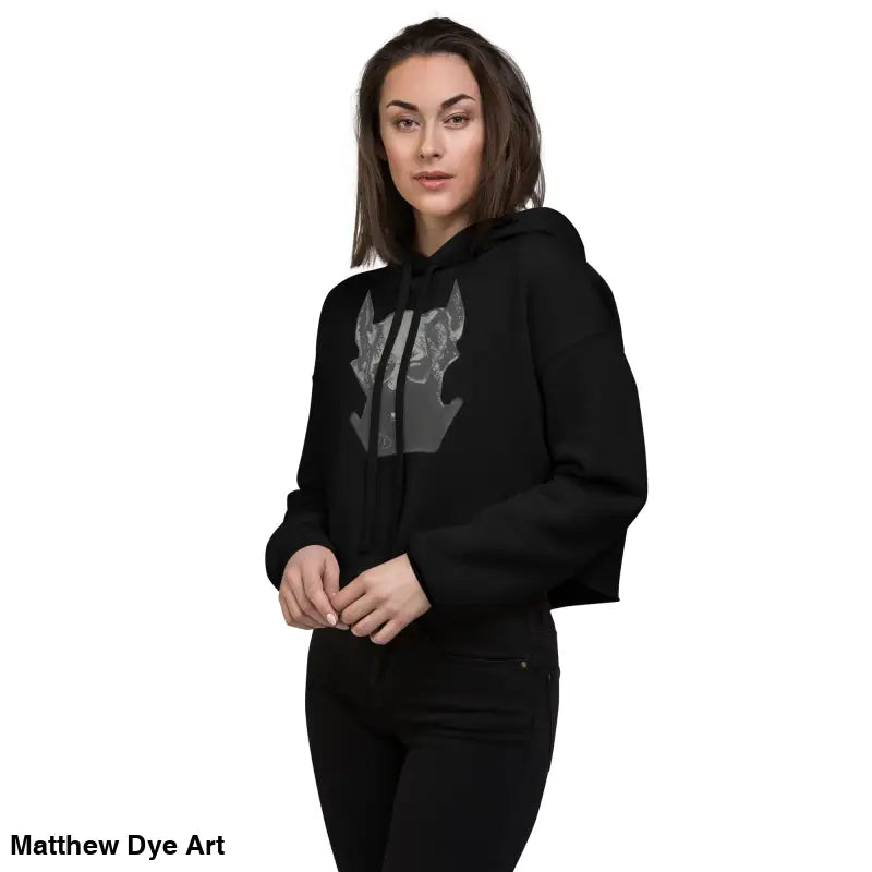 Black cropped hoodie featuring sinister figure design and dropped shoulder cut