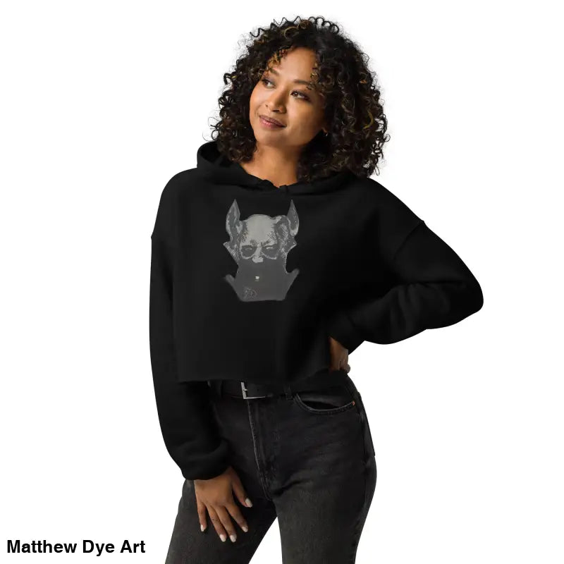 Black cropped hoodie featuring a sinister figure design and dropped shoulder cut