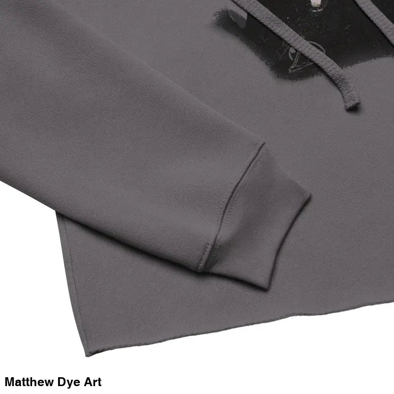 Gray cropped hoodie sleeve featuring sinister figure design with dropped shoulder cut