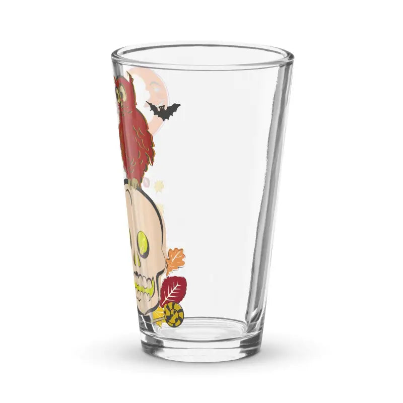 Clear drinking glass with skull, autumn leaves, and bat design for enchanting sips