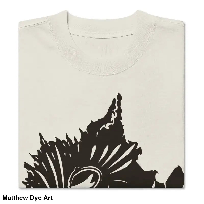 Folded beige oversized faded t-shirt featuring dark floral design for Snarling Nightmare