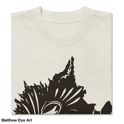 Folded beige oversized faded t-shirt featuring dark floral design for Snarling Nightmare