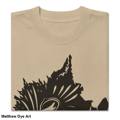 Folded beige oversized faded t-shirt featuring dark floral design from Snarling Nightmare