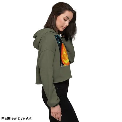 Cropped olive green hoodie featuring Matthew Dye art with a spooky cute jack-o’-lantern design