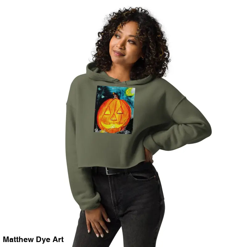 Woman in a spooky cute pumpkin hoodie featuring a Jack-o’-lantern design by Matthew Dye Art