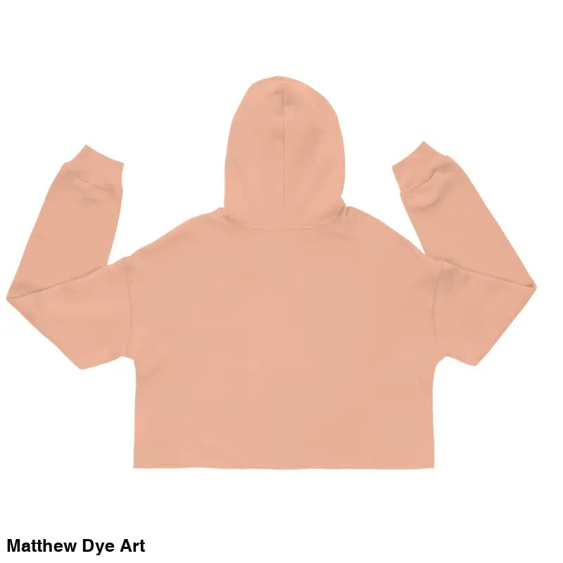 Peach-colored cropped hoodie featuring a Spooky Cute jack-o’-lantern design by Matthew Dye Art