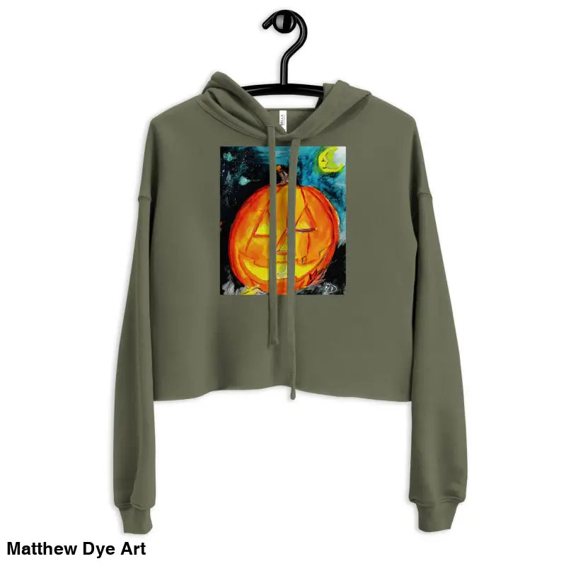 Olive green cropped hoodie featuring Matthew Dye art with a spooky cute jack-o’-lantern design