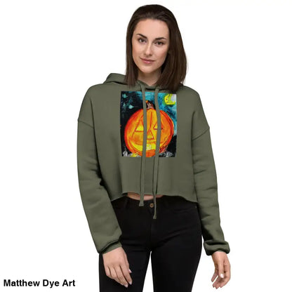Woman modeling a Spooky Cute & Cozy Pumpkin Glow hoodie with a Jack-o’-lantern design