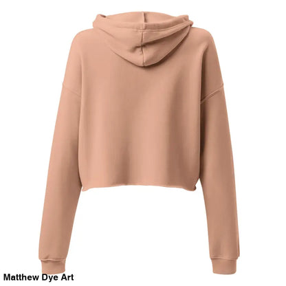 Tan cropped hoodie featuring a spooky cute Jack-o’-lantern design by Matthew Dye Art