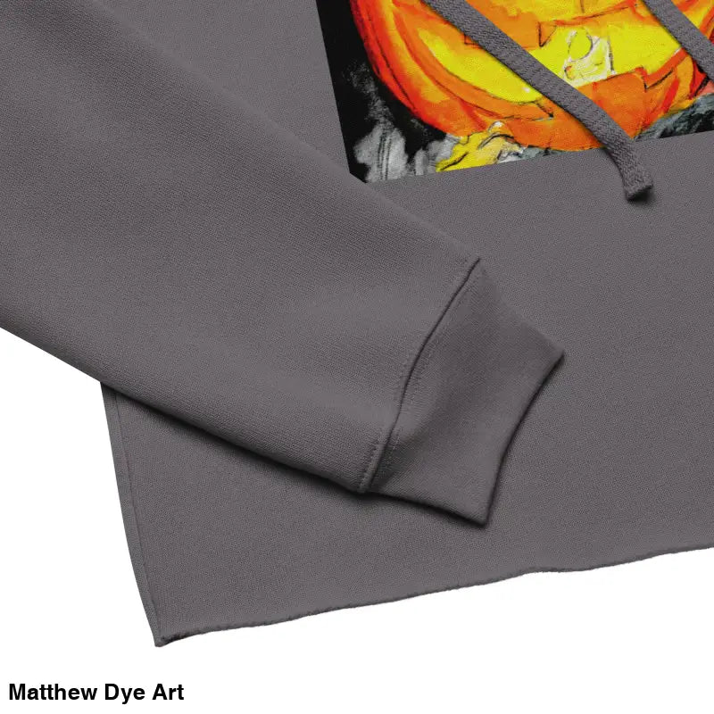 Gray cropped hoodie featuring Spooky Cute Pumpkin Glow and Matthew Dye Art jack-o’-lantern design