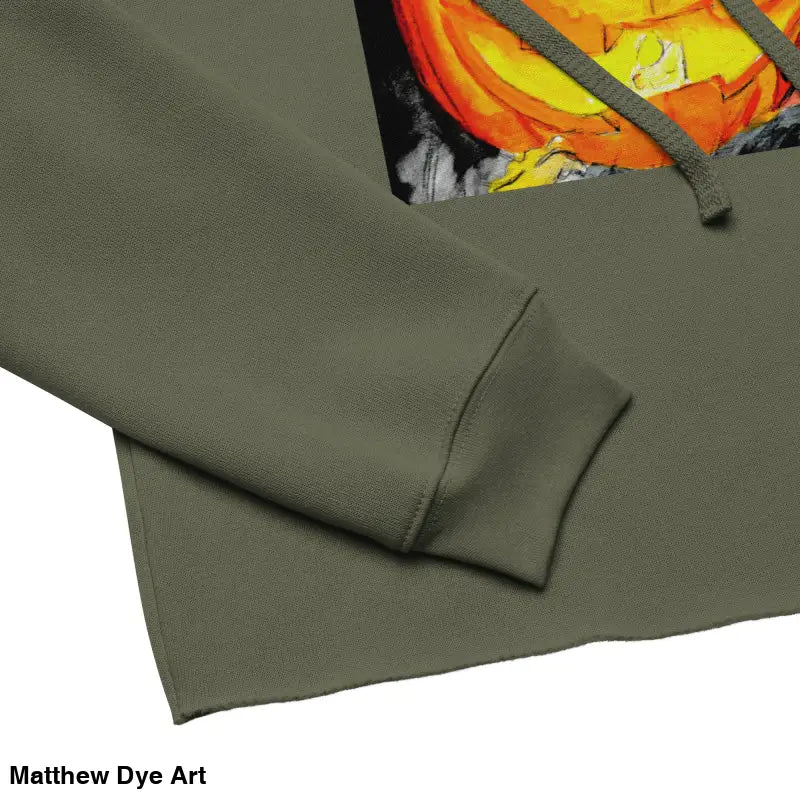 Olive green cropped hoodie featuring a Spooky Cute Jack-o’-Lantern design by Matthew Dye Art