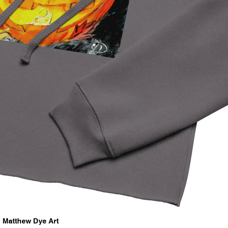 Gray cropped hoodie featuring a spooky cute jack-o’-lantern design by Matthew Dye Art