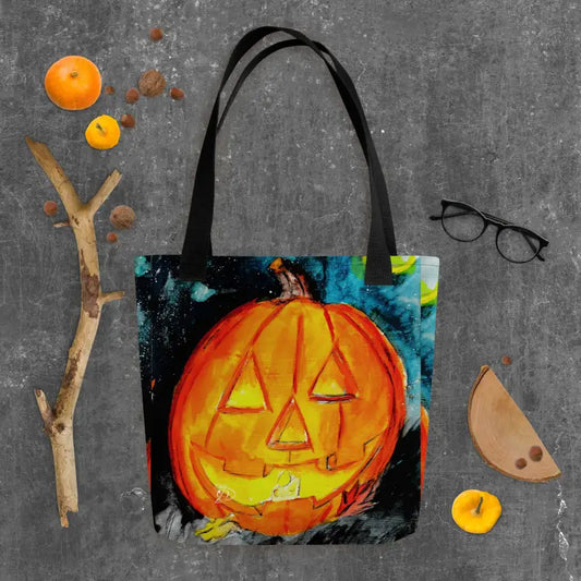 Spooky & sustainable reusable tote bag featuring an orange Halloween jack o’ lantern art