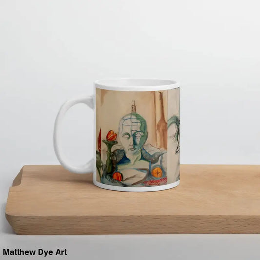 White ceramic mug featuring Matthew Dye art and floral designs in glossy finish