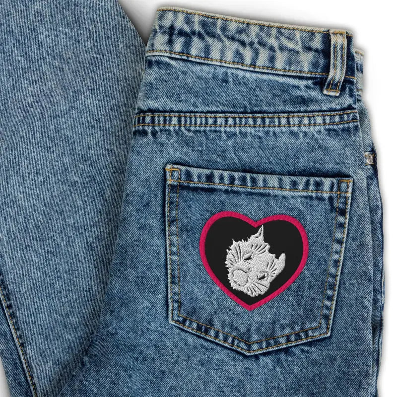 Acid-wash jeans featuring an Ah Kitty embroidered patch for Halloween fashion