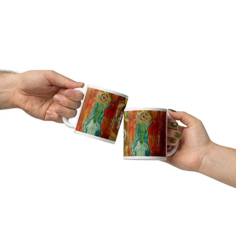 Two hands exchanging Matthew Dye’s The Priestess ceramic mug with vibrant designs