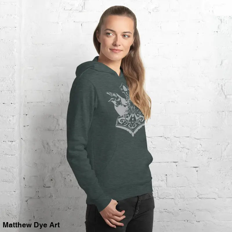 Woman in a comfortable Viking unisex pullover hoodie featuring Thor’s Mjolnir and Odin’s Ravens