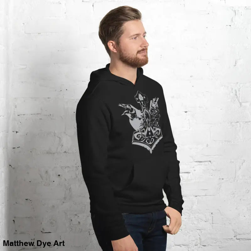 Black hoodie featuring Norse design of Thor’s Mjolnir and Odin’s Ravens, comfortable Viking unisex pullover