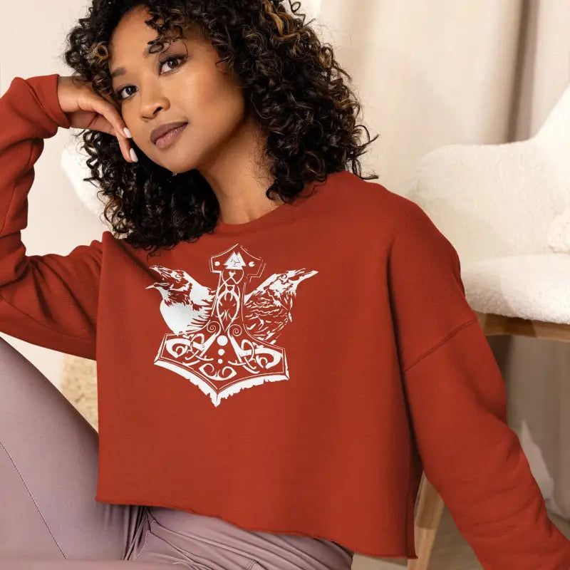 Rust-colored cropped sweatshirt with Norse Thor’s hammer design for Valkyrie Spirit style