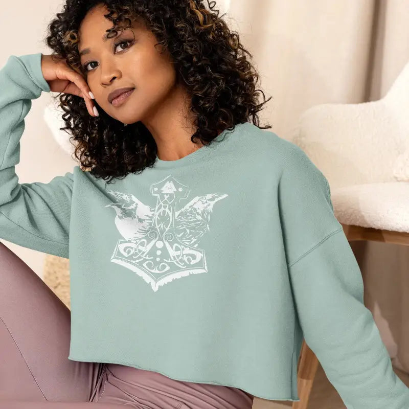 Mint green cropped sweatshirt with a white Thor’s hammer design for the Valkyrie Spirit collection