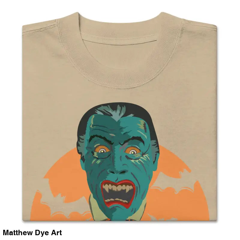 Folded beige oversized unisex faded t-shirt with vintage vampire graphic for Halloween