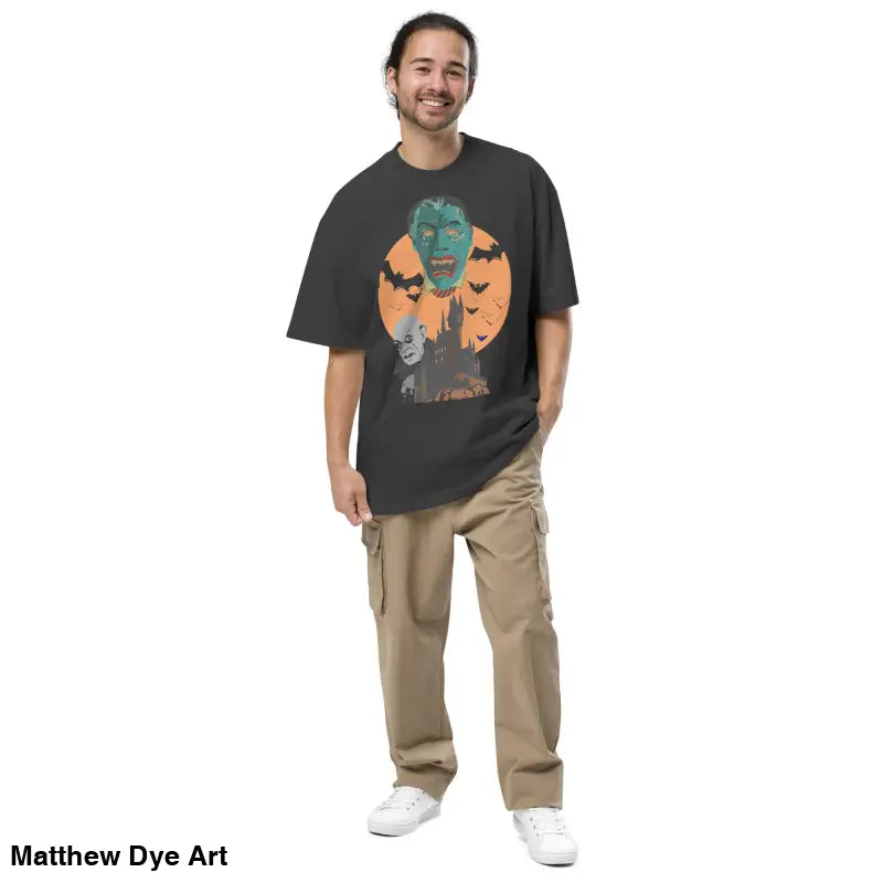 Man wearing a monster graphic shirt for Halloween in oversized unisex faded t-shirt