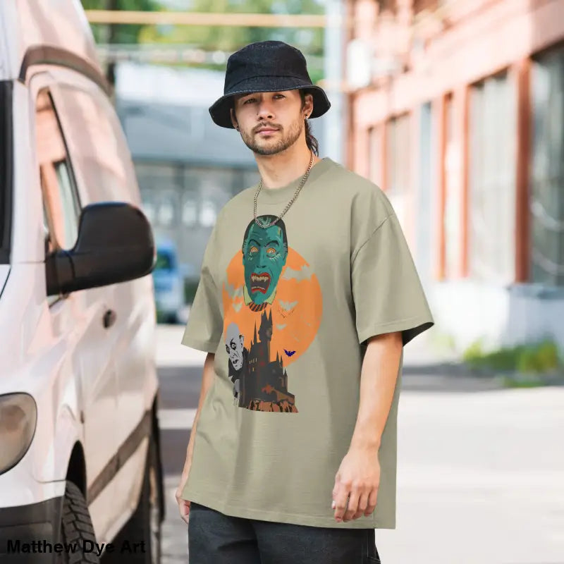 Man showcasing an oversized unisex faded t-shirt for Halloween with a vintage-style design