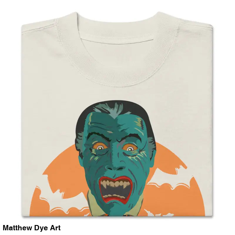 Folded oversized unisex faded t-shirt featuring a vampire graphic for Halloween style