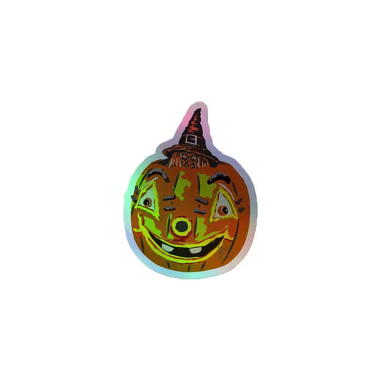 Holographic sticker of a smiling jack-o’-lantern wearing a witch hat by Matthew Dye Art